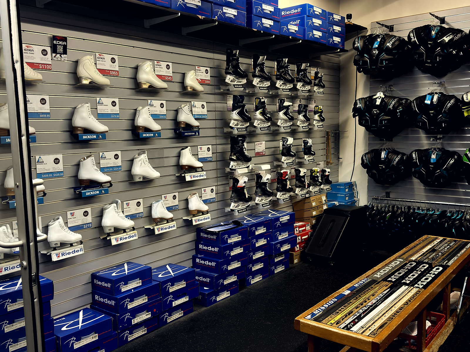 Inside Blade Department's skate and hockey gear wall.