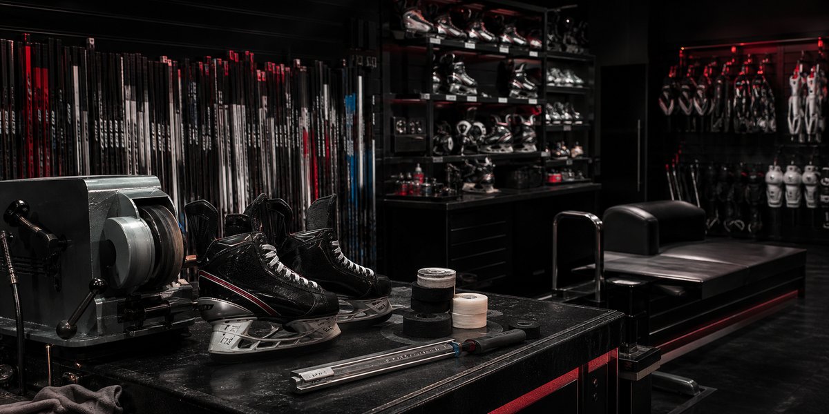 Inside Blade Department — skates, sticks, and the sharpening bench.